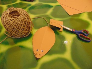 Stick wiggly eyes or draw them with a feltip